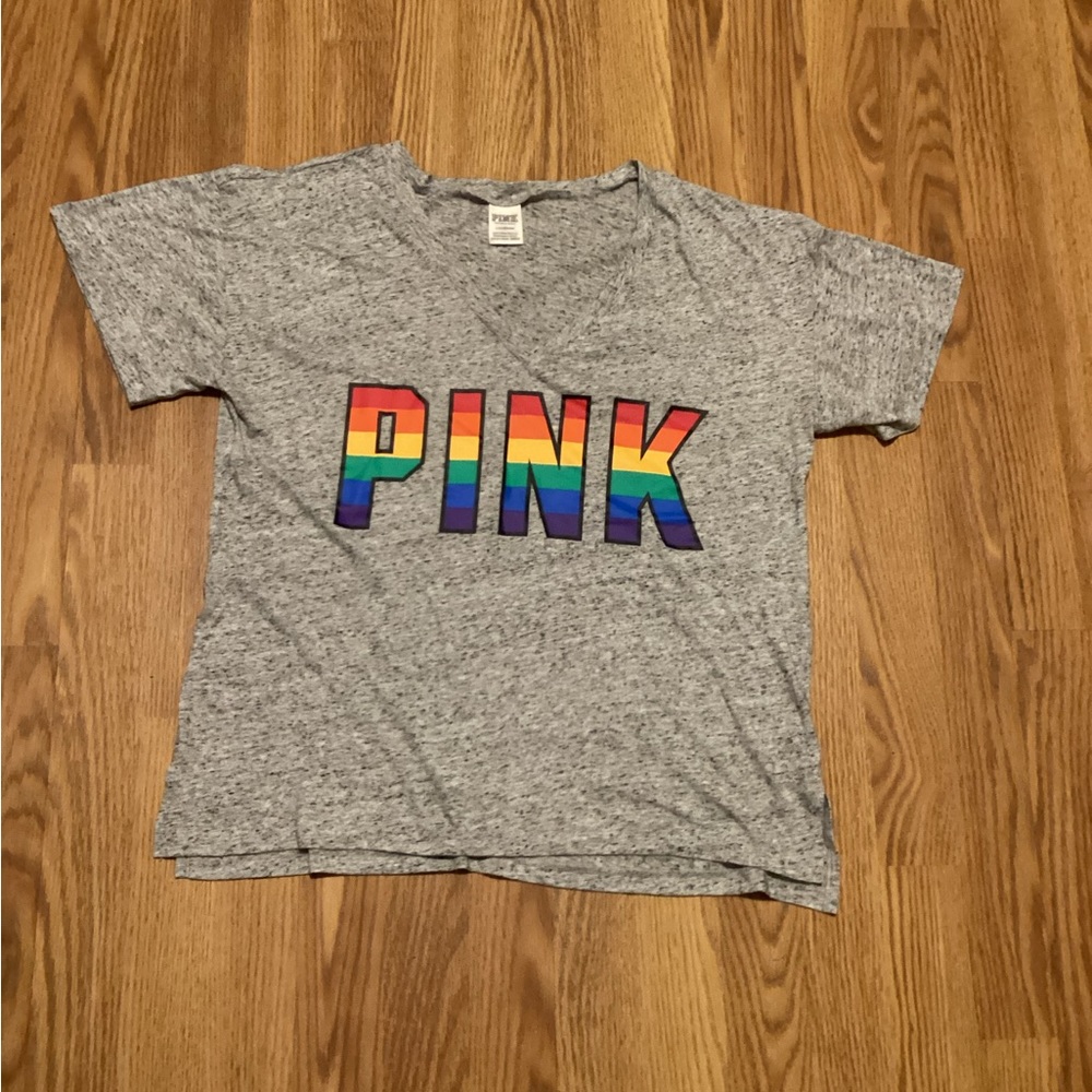 Pink women’s short sleeve t-shirt size large with letters on front color gray